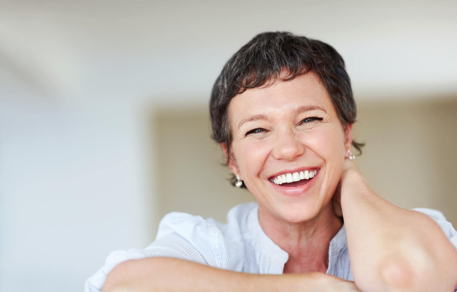 business-woman-enjoying-home-portrait-mature-business-woman-smiling-while-relaxing-home-min