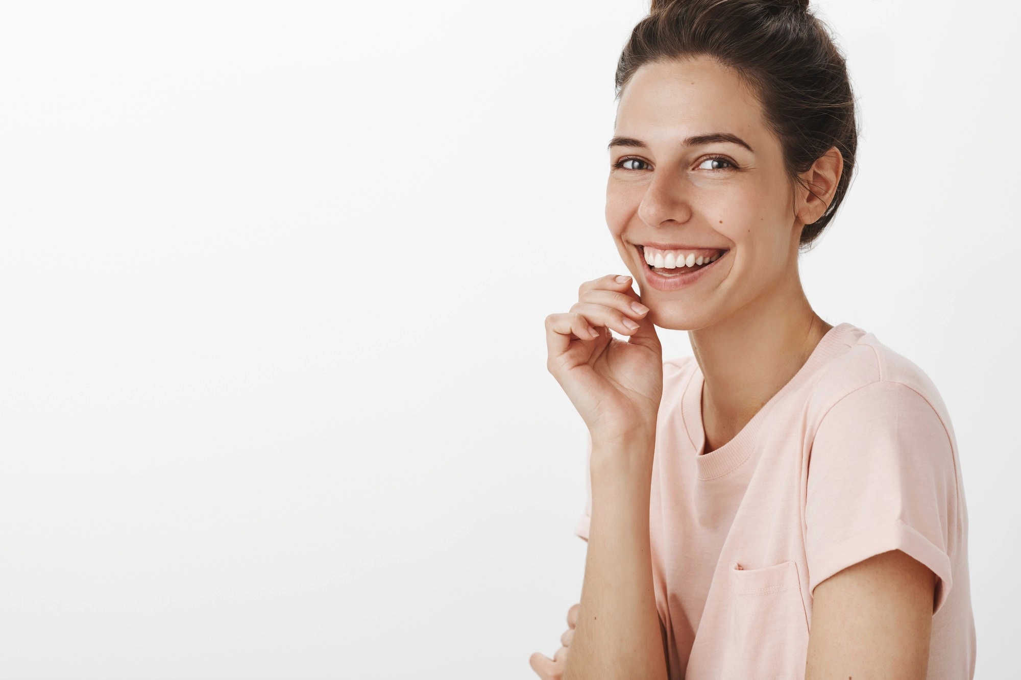 romantic-beautiful-girl-posing-against-white-wall